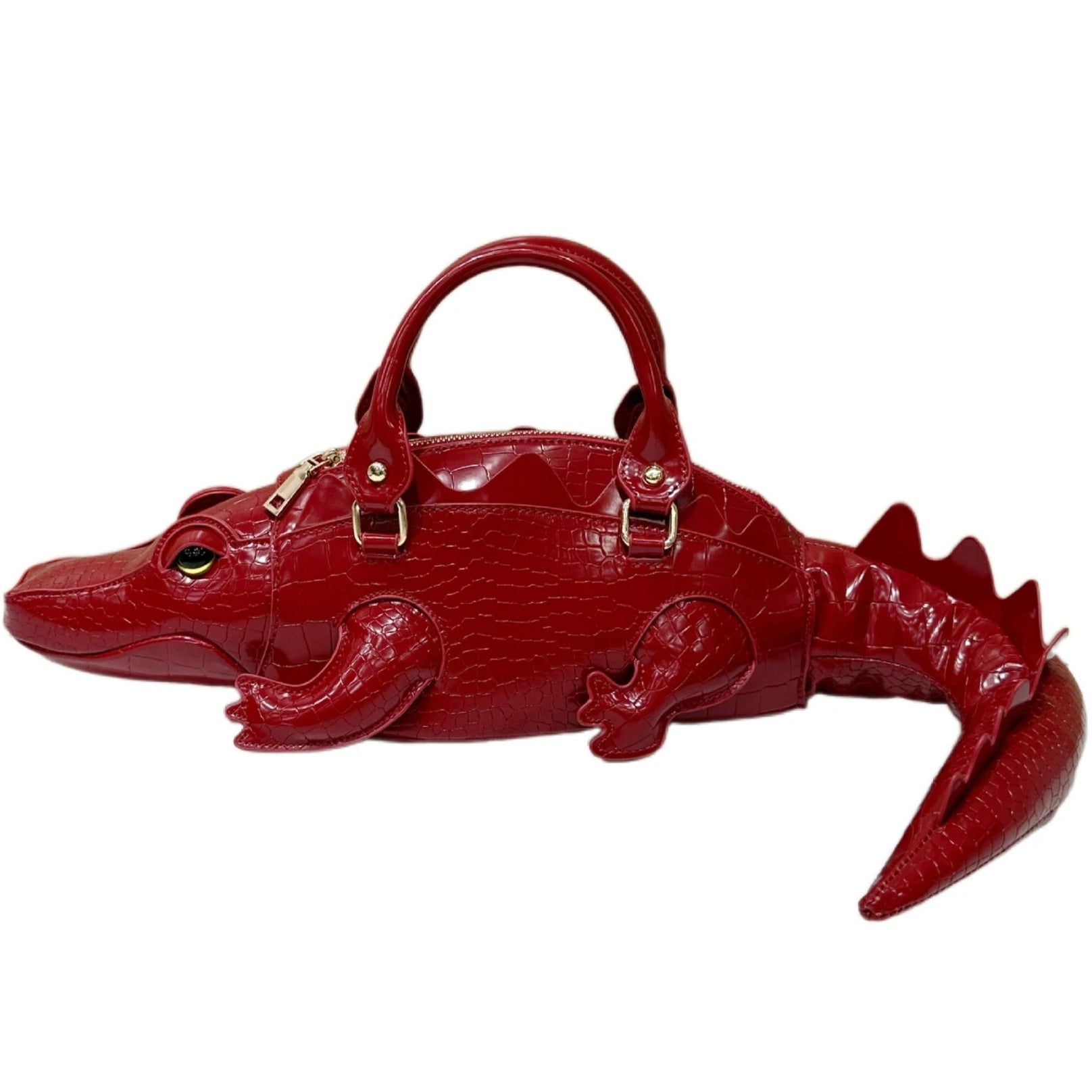 Red alligator-shaped handbag on a white background