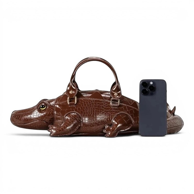 Pordein brown vegan leather alligator shoulder bag with croc-embossed body and tail detail.