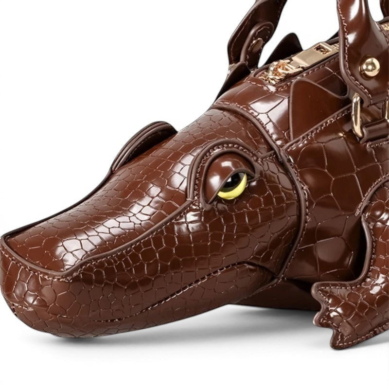 Pordein brown vegan leather alligator shoulder bag with embossed scales and yellow eye detail.