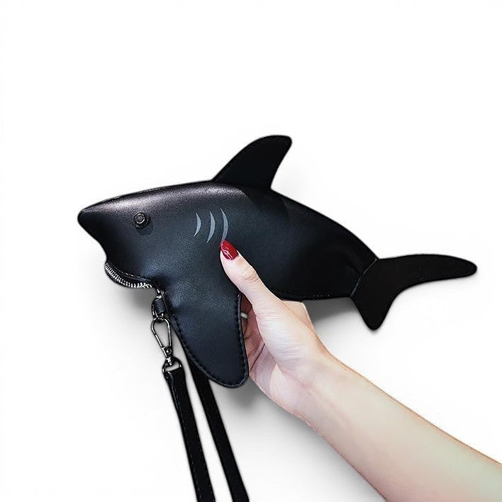 Pordein black PU leather Baby Shark mini bag with zip closure and optional strap, shaped like a shark.