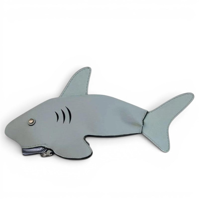 Pordein Baby Shark Mini Bag in light blue PU leather, shaped like a shark with a zip closure for teeth.