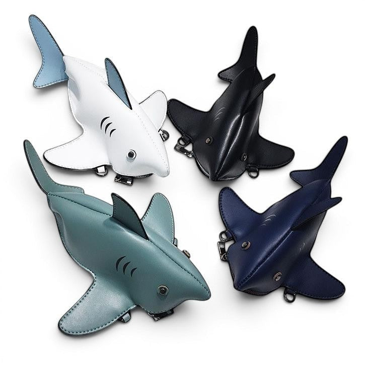 Pordein Baby Shark Mini Bag in white, black, teal, and navy blue PU leather. Features include shark fins and a zip closure.