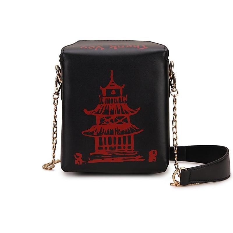 Pordein black faux leather mini bag shaped like a Chinese takeaway box with red pagoda and text detail.