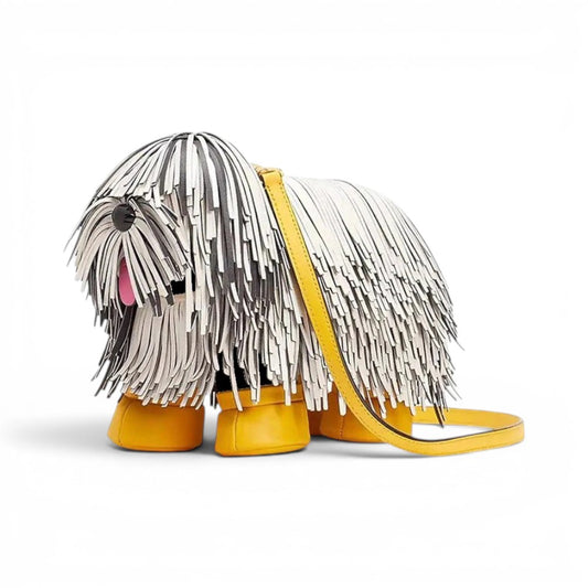 Pordein Cooper Cross Body Bag, a novelty vegan leather crossbody shaped like a dog with white and black fringe, yellow feet, and a yellow strap.