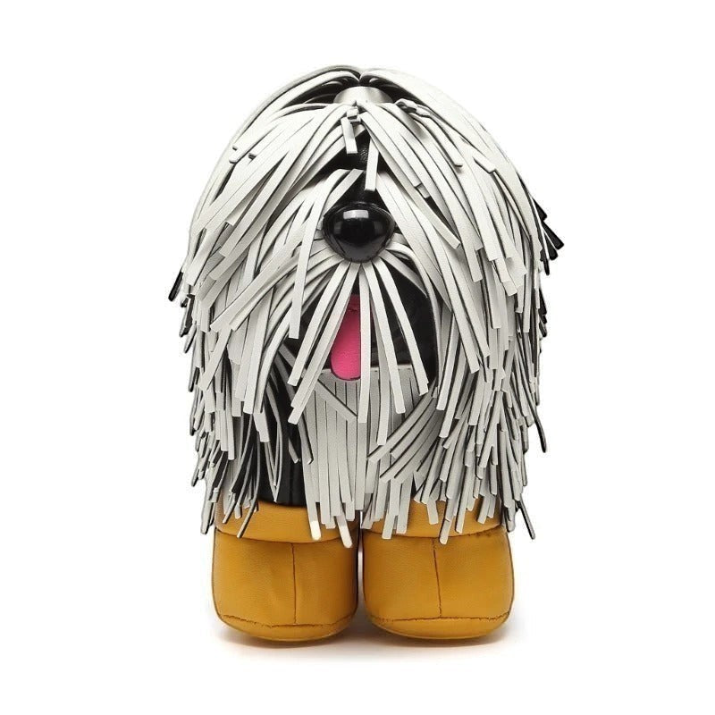 Pordein Cooper Cross Body Bag, a vegan leather crossbody shaped like a white shaggy dog with black eyes and a pink tongue.