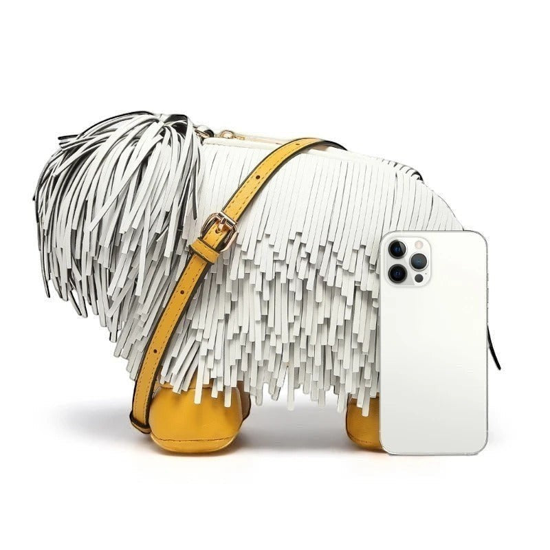 Pordein Cooper Cross Body Bag, white vegan leather with fringe, yellow accents, and gold hardware. Shaped like a dog.