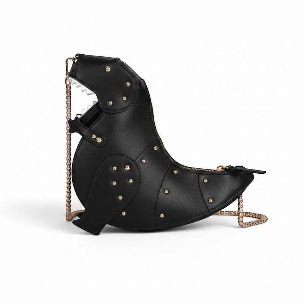 Pordein pink vegan leather dinosaur-shaped mini bag with gold stud detailing and chain strap.