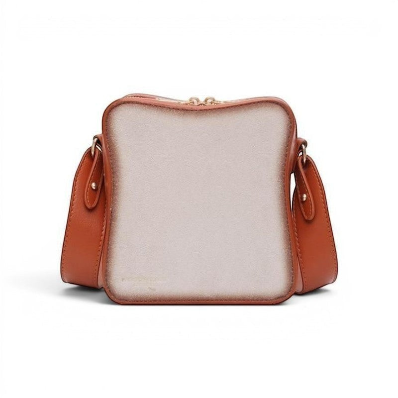 Pordein Eggs & Toast mini shoulder bag, a fun novelty bag made of vegan leather, designed to look like a slice of toast with a light beige interior and brown crust trim.