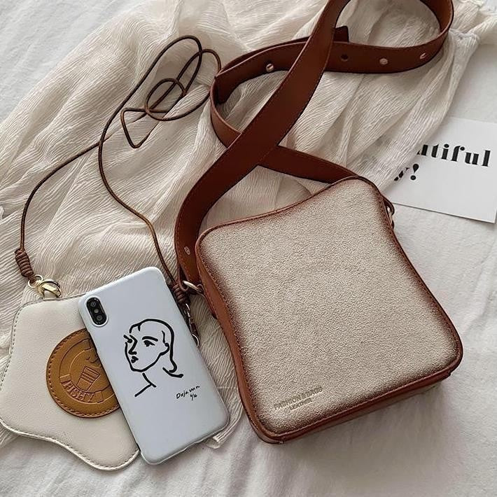 Pordein Eggs & Toast mini bag, a novelty PU leather shoulder bag designed to look like a slice of toast with a brown strap and a separate mini egg purse.