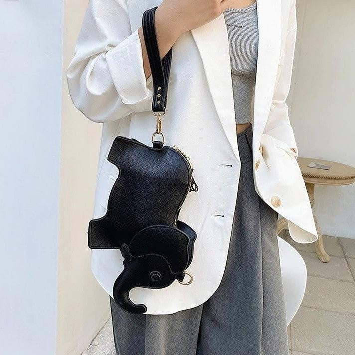 Pordein Elly Mini Bag, a black elephant-shaped PU leather handbag with optional straps, perfect for essentials.