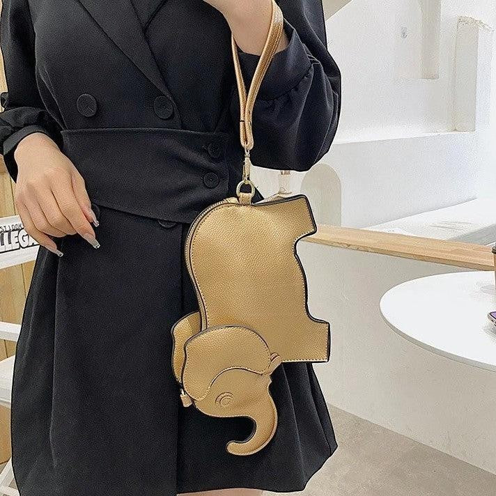 Pordein Elly Mini Bag, a gold elephant-shaped PU leather handbag with optional straps, perfect for essentials.