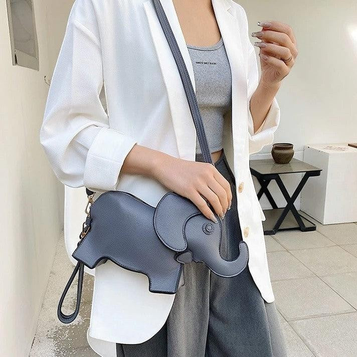 Pordein Elly Mini Bag, a grey elephant-shaped crossbody bag made of PU leather with optional straps.