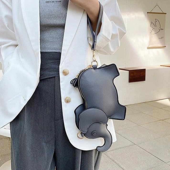 Pordein Elly Mini Bag, a grey elephant-shaped PU leather handbag with optional straps, perfect for essentials.