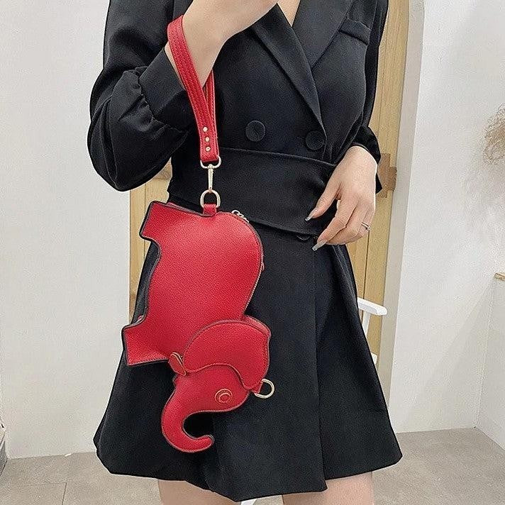 Pordein Elly Mini Bag, a red elephant-shaped PU leather handbag with optional straps, perfect for essentials.