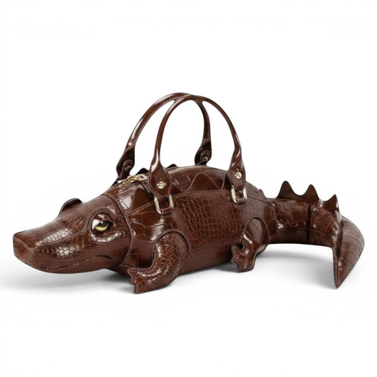 Pordein brown crocodile-embossed vegan leather shoulder bag shaped like a gator with dual top handles and gold-tone hardware.