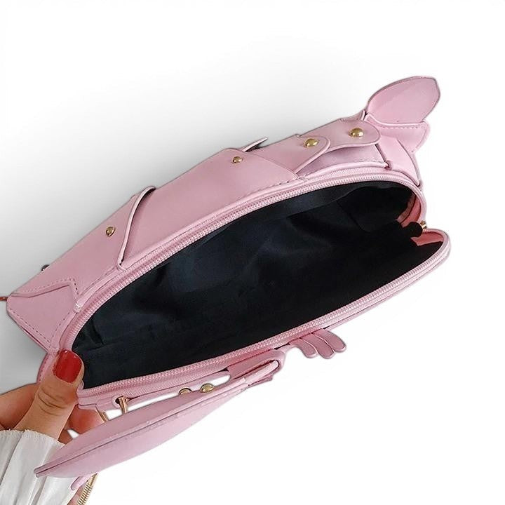 Pordein pink PU leather lobster mini bag with zipper closure and gold hardware. Playful accessory.
