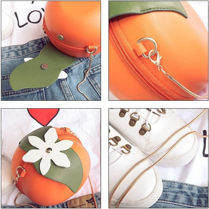 Pordein orange vegan PU leather mini bag with green leaf and white flower detail. Can be worn as handbag or clutch.