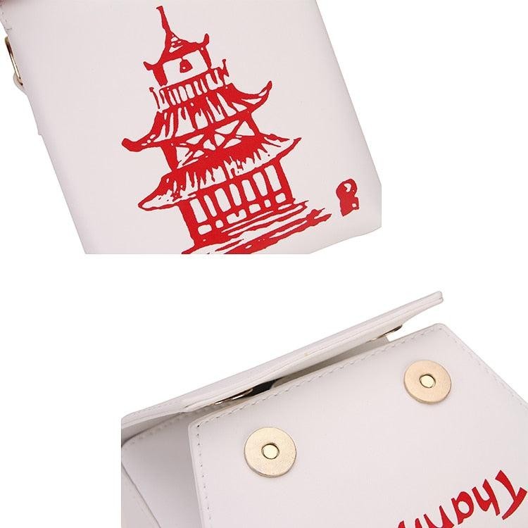 Pordein white PU leather mini bag shaped like a Chinese takeaway box with red pagoda graphic.