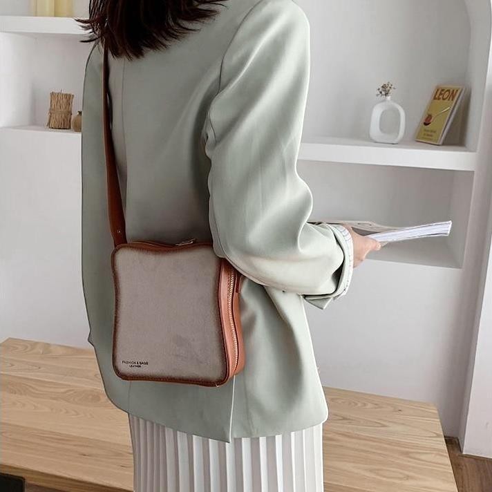 Pordein Eggs & Toast Mini Bag, a quirky shoulder bag made of tan PU leather designed to look like a slice of toast.