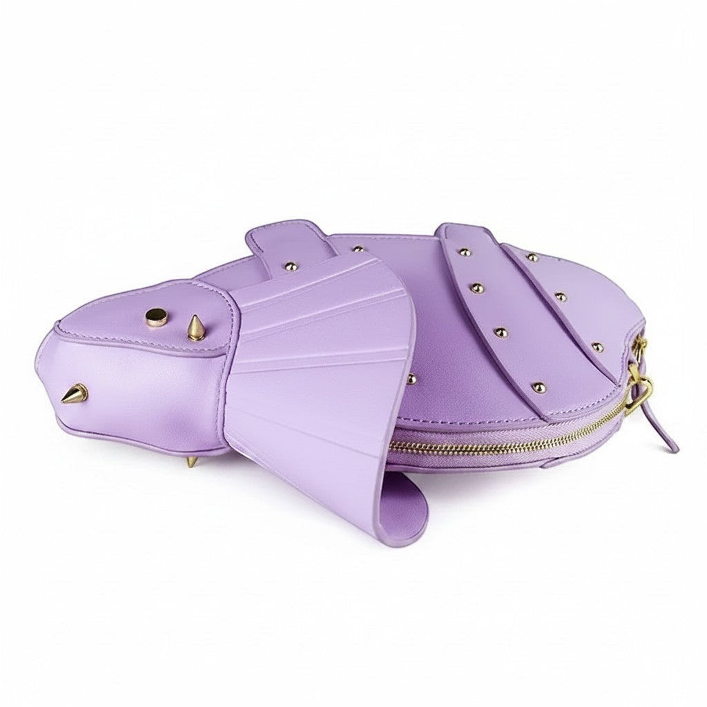 Pordein Triceratops Mini Bag in lavender vegan leather with gold stud details and a gold chain strap.