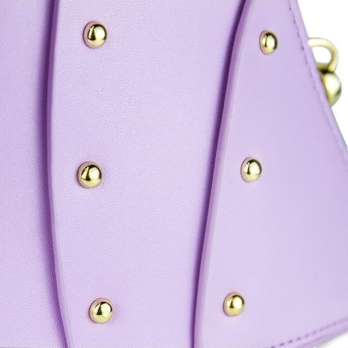 Pordein Triceratops Mini Bag in lavender vegan leather with gold stud details and a unique frill design.