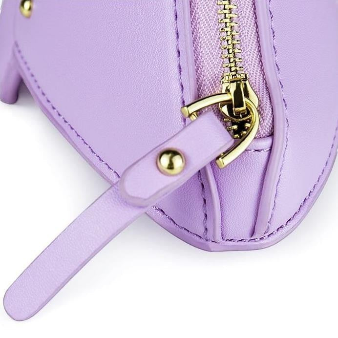 Pordein Triceratops Mini Bag in lavender vegan leather with gold zipper and stud detail.