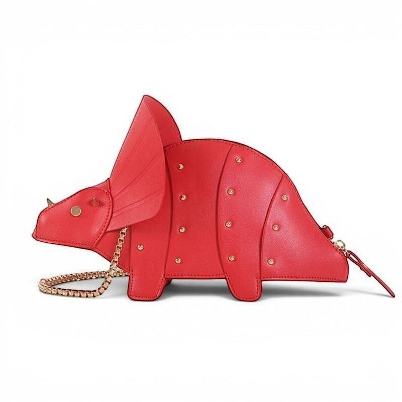 Pordein red vegan leather Triceratops mini bag with gold stud details and chain strap.