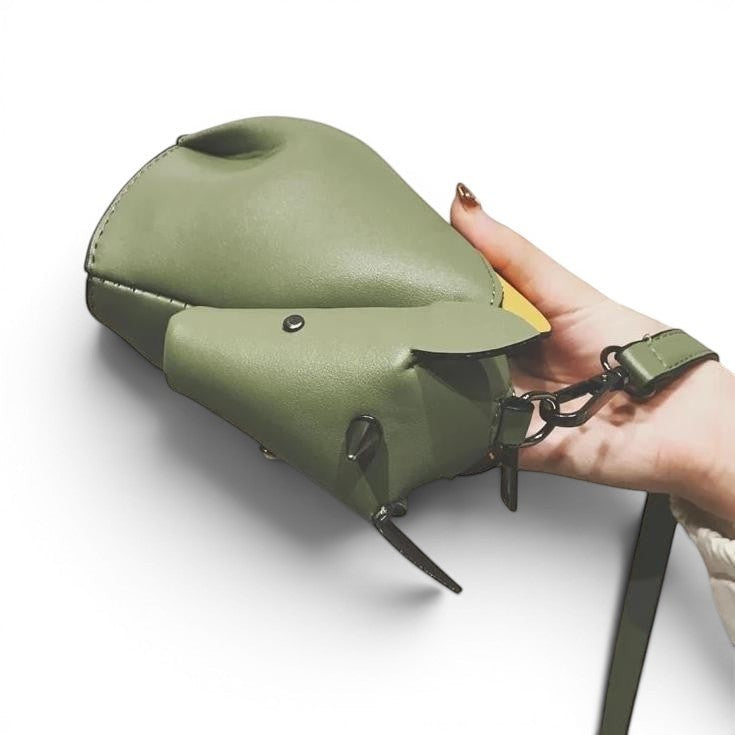 Pordein green PU leather unicorn mini bag with yellow accent and adjustable strap.