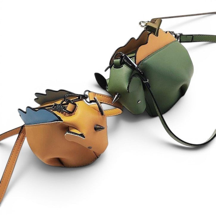 Pordein whimsical PU leather mini bags in yellow and green with blue accents and spiked details.