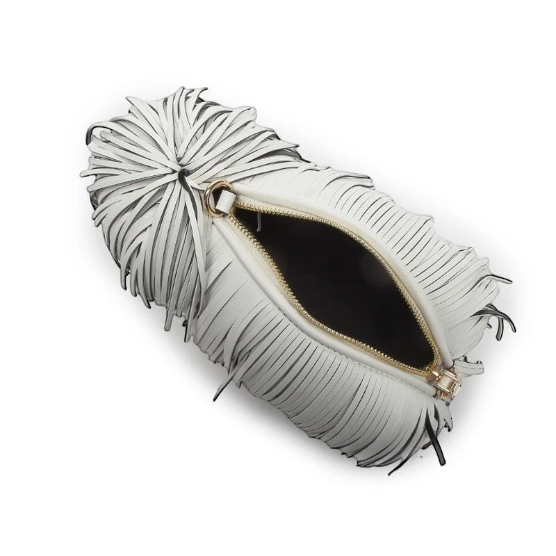 Pordein white vegan leather crossbody bag with fringe detail and gold-tone zipper, shaped like a dog.